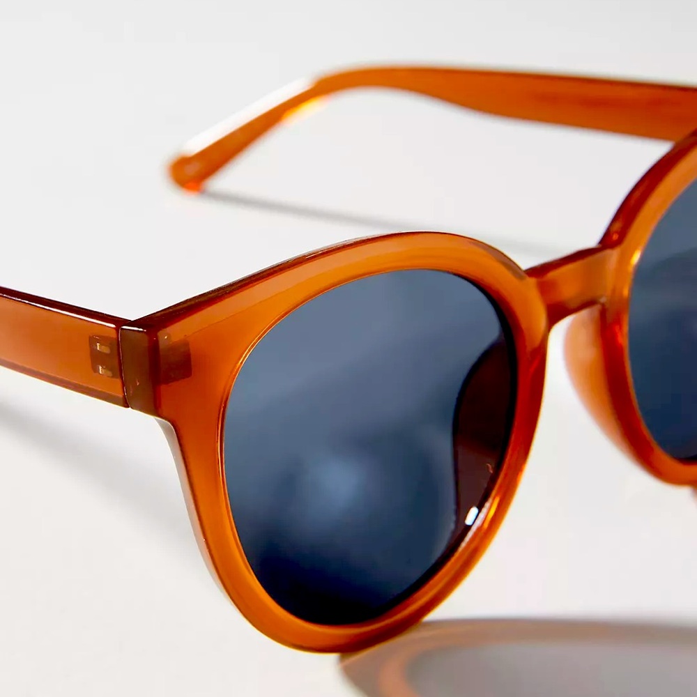 Monday Round Sunglasses by Anthropologie. taupe color